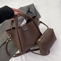 Brown litchi leather bucket bag with matching small pouch and golden hardware details - Shoulder Bag Set / Brown
