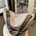 Beige oversized PU leather hobo bag with ethnic style wide strap and golden hardware - Off-White
