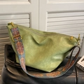Grass green crescent crossbody bag with ethnic patterned wide strap and gold hardware - Green