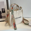 Cream canvas bucket bag with floral shoulder strap and J CHAO logo for women - White Contrast