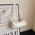White cylindrical crossbody bag featuring leather knot decor and gold zipper hardware - White Without Pendant