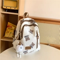 Schattige gebroken witte rugzak met bruine berenprint en een zachte pomponhanger - Bruin met Hanger