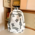 Quilted white backpack with bear print and green zippers for school and travel - Green