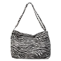 Minimalist canvas shoulder bag featuring a classic black and white zebra print and button - White Zebra Print