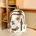 White backpack with cartoon bear pattern and brown handle, large capacity for school - Brown