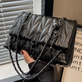 Black V-quilted shoulder bag with matte metal chain and U-shaped buckle detail - Black