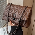 Dark brown quilted leather chain bag with V-shaped stitching and matte black lock - Brown