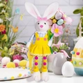 Detail of Easter bunny doll with beaded legs holding a flower for festive home decor - Yellow Dress Style (Female)