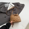 Brown quilted leather bucket bag with drawstring closure and adjustable strap - Khaki
