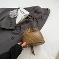 Caramel brown quilted bucket bag with drawstring closure and golden metal hardware - Tan