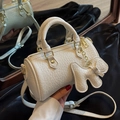 White mini cylinder boston bag with litchi texture and dog charm accessory - Off-white