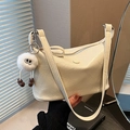 Creamy white pleated hobo bag with zip closure and cute plush mascot charm - White