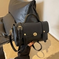 Classic black crossbody bag with gold buckle on a stone base, stylish handle bag - Black