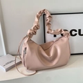 Minimalist light pink crescent tote bag with pleated cloud handle and metal charm - Pink