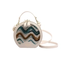 Elegant round crossbody bag in beige with colorful wave pattern and gold zipper detail - White