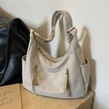 Large beige canvas hobo tote bag with multiple zippers and wide shoulder strap - Off White