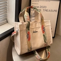 Crèmekleurige canvas shopper met kleurrijke geborduurde bloemenbanden en logo - Off-wit