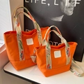 Set di borse tote in tela arancione con ricamo floreale e tracolla regolabile - Grande / Arancione