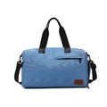 Light blue Oxford cloth travel bag with brown leather patch and black shoulder strap - Blue
