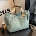 Light green canvas tote bag with floral embroidered straps and multiple pockets - Green
