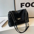 Black chain tote bag with silver hardware and leather strap for daily commuting - Black