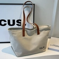 Minimalistische beige Canvas-Tasche mit braunen Ledergriffen und schwarzem TELN-Schriftzug - Cremeweiß