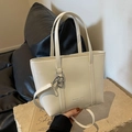 Creamy white minimalist faux leather tote bag with dual straps and gold logo lettering - Off White