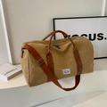 Khaki canvas travel bag with brown leather handles and adjustable shoulder strap - Khaki