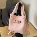Pink lychee grain leather bucket bag with gold buckle and adjustable crossbody strap - Pink