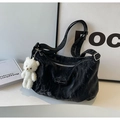 Detail of black pleated tote bag featuring a cute white plush bear charm and zip closure - With Pendant / Black