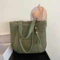 Handwoven grass green straw tote bag with woven handles and long tassel wooden bead charm - Green