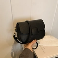 Chic black lychee grain leather crossbody bag with gold hardware and flap closure - Black