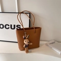 Caramel brown pebbled leather tote bag with a cute rabbit plush charm pendant - Biscuit