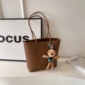 Dark brown pebble leather tote bag with a cute plush rabbit pendant charm for women - Brown
