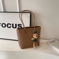 Brown lychee leather tote bag with a cute plaid rabbit charm and minimalist design - Dark Khaki