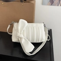 Chic creamy white pleated crossbody bag featuring a large bow and silver hardware - White