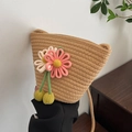 Woven straw bucket bag in beige with handmade floral charms for summer vacations - Khaki