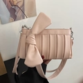 Pink crossbody bag with oversized bow and vertical pleats for women's fashion - Pink