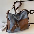 Borsa tote in tela blu con tasche in pelle marrone e ampia tracolla in tessuto morbido - Blu