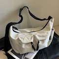 White nylon crescent crossbody bag with two front flap pockets and wide black shoulder strap - Off White