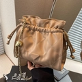 Chic camel quilted bucket bag with golden chain strap and triangle logo charm - Khaki