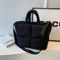 Black quilted tote bag in padded nylon with adjustable strap and fluffy texture for daily use - Black