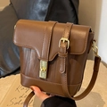Brown vintage leather bucket bag with wave embossing and gold-tone twist lock - Brown