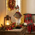 Detail of Christmas duck plush toy with red-green plaid outfit and festive scarf - Extendable Duck