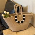 Handwoven straw tote bag with pompom charm and sturdy handles for beach vacations - Beige (Black & White Pom Poms)