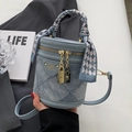 Blue denim patchwork bucket bag with silk scarf handle and golden hardware accent - Blue Without Charm