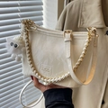White marble pattern bucket bag with gold chain strap and fluffy monster charm - Off White