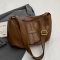 Brown faux leather hobo crossbody tote bag with adjustable strap and embossed label - Brown