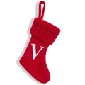 Red knit Christmas stocking with white letter V and hanging loop on white background - Letter V
