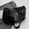 Minimalist black pleated tote bag in matte PU leather with adjustable strap and logo detail - Black Without Charm